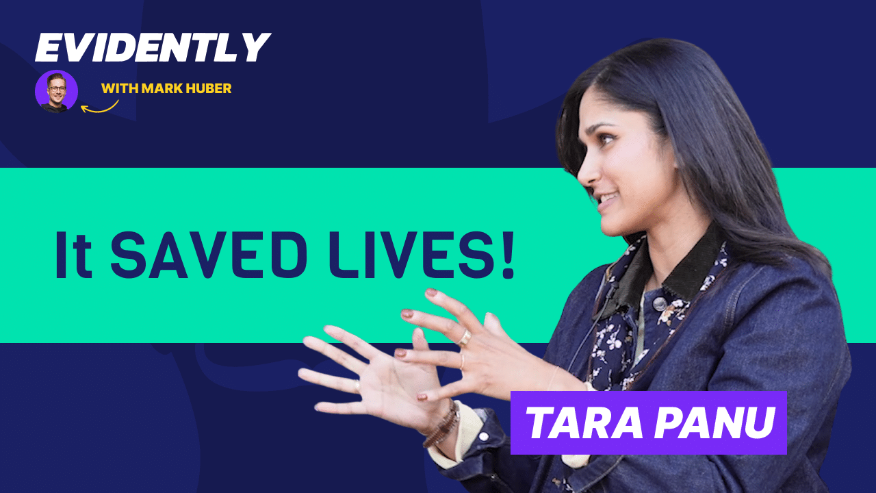A woman gestures while speaking on the Evidently with Mark Huber show. Bold text reads It SAVED LIVES! and a label says TARA PANU. The background is dark blue and teal.